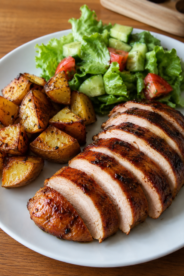 Sliced juicy smoked chicken breast ready to serve