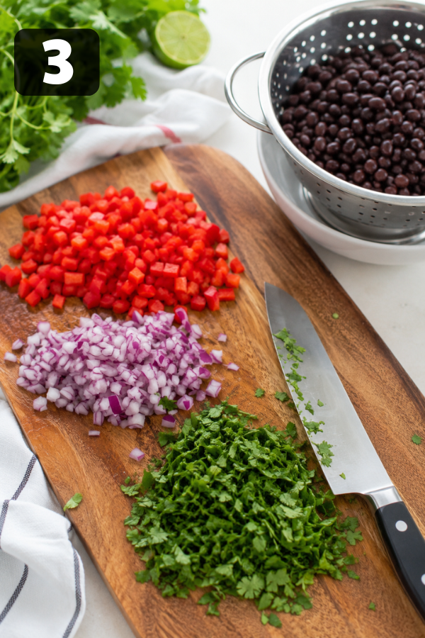 Vegetables and beans prepared for sweet potato black bean salad meal prep recipe