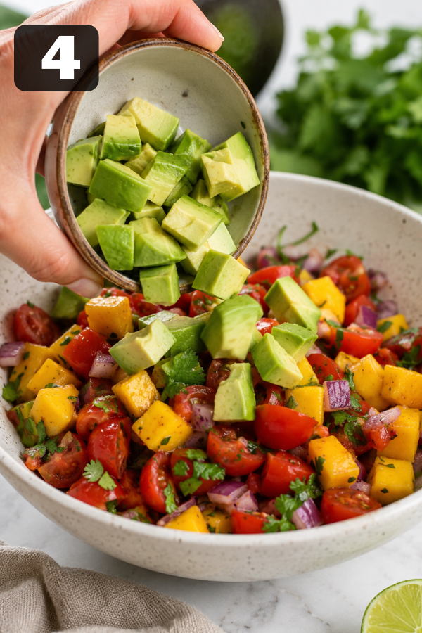 Diced avocado added last to the salad bowl to keep the pieces creamy and fresh.