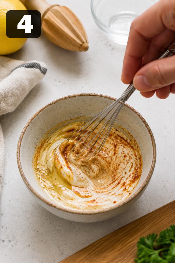 Mayonnaise, Dijon mustard, garlic powder, smoked paprika, salt, and pepper mixed into a creamy dressing
