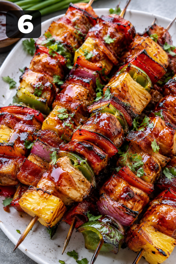 Finished grilled skewers brushed with barbecue sauce and ready to serve