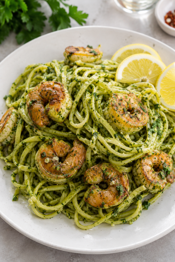 Chimichurri shrimp pasta for a summer high protein dinner with shrimp, fresh herbs, garlic, olive oil, and vegetables
