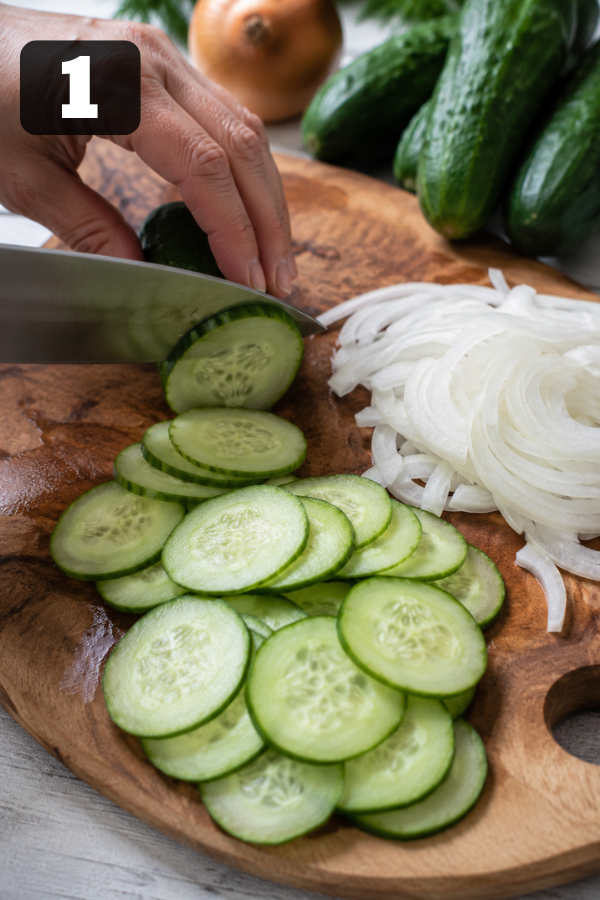 Fresh pickling cucumbers being washed, trimmed, and sliced into thin rounds for bread and butter pickles