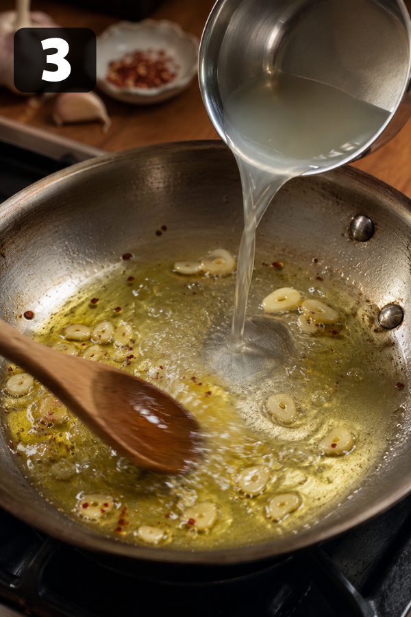 Pasta water added to garlic olive oil sauce to make the spaghetti glossy and light