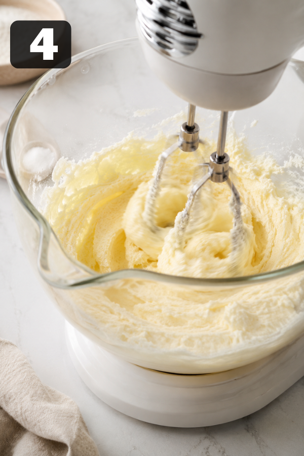 Creaming butter and sugar together until light and fluffy in mixing bowl