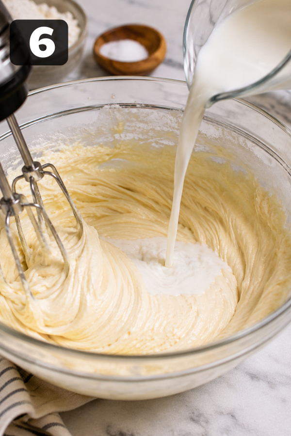 Alternating dry ingredients and milk or yogurt into cake batter while mixing gently