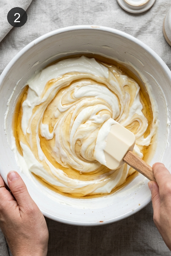 stirring greek yogurt and honey for yogurt bark