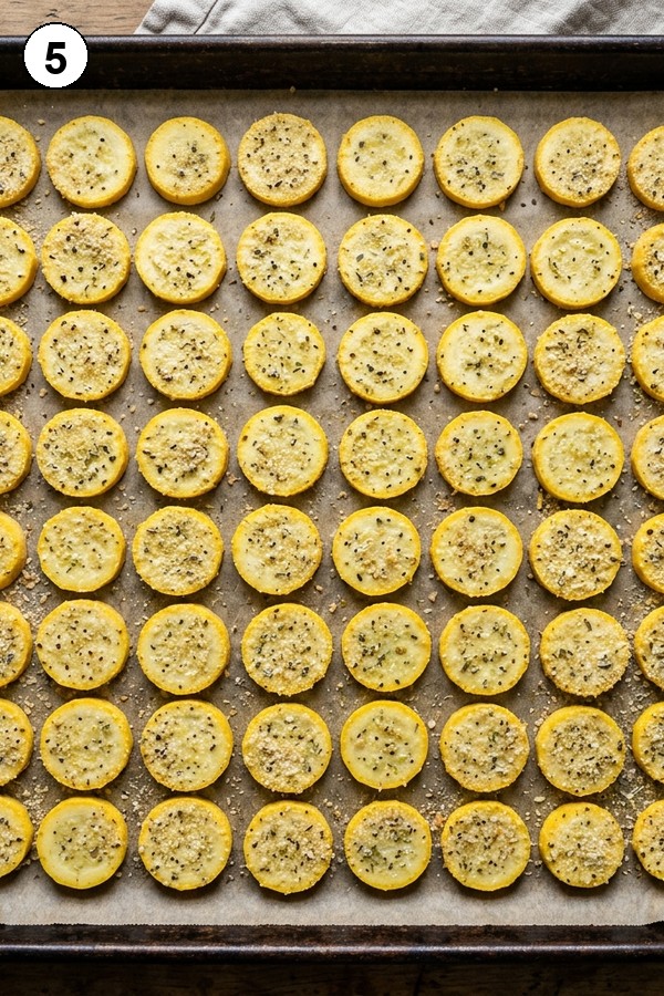 yellow squash rounds single layer on baking sheet before oven