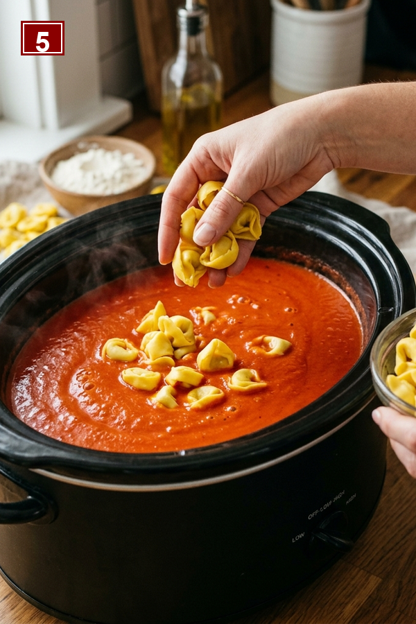 Step 5 adding cheese tortellini to the blended soup
