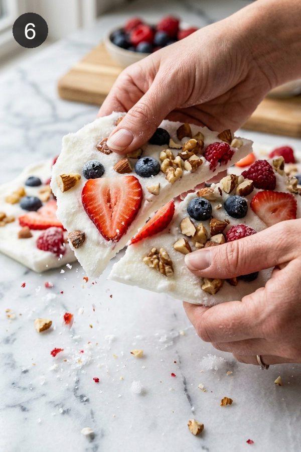 breaking frozen yogurt bark into pieces
