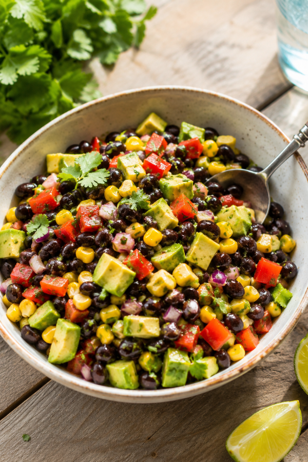 Vibrant black bean corn avocado salad with fresh lime dressing in a bowl