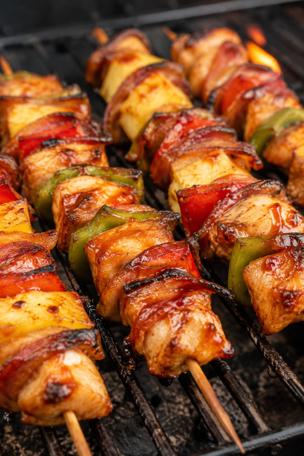 BBQ Chicken Bacon Pineapple Kabobs with grilled chicken, bacon, pineapple, peppers, and barbecue glaze